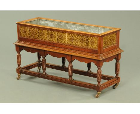 A 19th century jardiniere, of rectangular form with zinc lining, the sides inset with floral ceramic tiles and raised on a mo