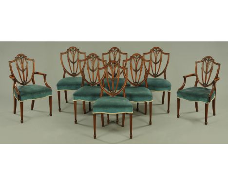 A set of eight (6+2) Hepplewhite style mahogany shield back dining chairs, each with a Prince of Wales plume of feathers to t