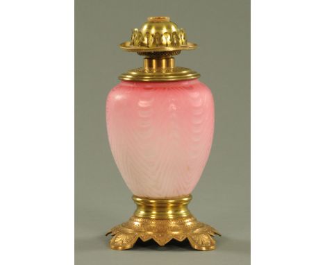 A Victorian pink satin glass oil lamp, with brass mounts, converted to electricity.  Overall height 31.5 cm.  CONDITION REPOR