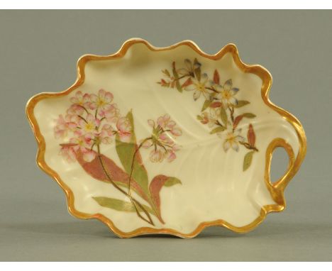 A Royal Worcester blush ivory leaf patterned dish, circa 1890, with floral spray decoration heightened with gilding, puce pri