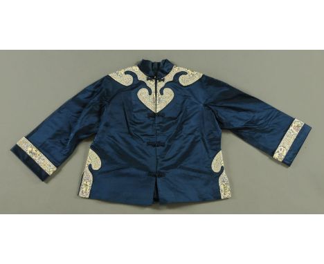 A Chinese blue silk jacket, 19th century and later, with hand embroidered cloud collar and sides with embroidered cuffs, the 
