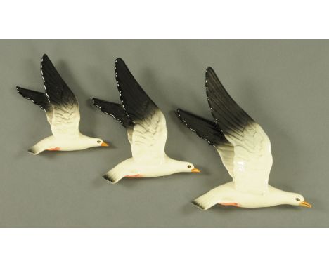 Three Beswick graduated wall mounted seagulls, Model Nos. 922-1 through to 922-3, printed marks and inscribed "61".  Tallest 