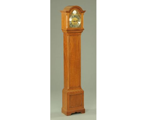 An Elliott of London eight day lever Westminster & Whittington chime grandmother clock, in walnut veneered case, with three-t