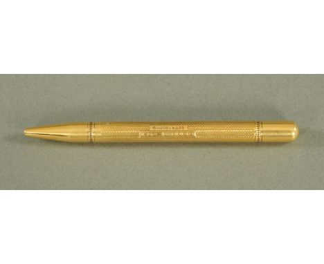A Mordan & Co. 18 ct gold propelling pencil, London 1911, with engine turned decoration.  Length 9.5 cm, 13 grams gross.  CON