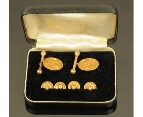A pair of Chinese gold coloured metal cufflinks, of oval form and with character mark, indistinctly struck 18 HK, together wi