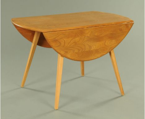 An Ercol light elm drop leaf dining table, having a well figured top with elliptical drop leaves, all supported upon square t