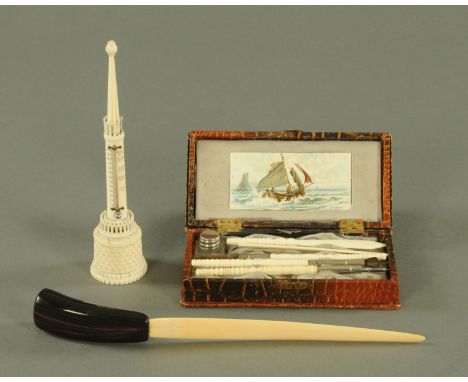 A turned ivory handled pen set in fitted box, the dip nib in the form of a pointing finger, all within a fitted case inscribe