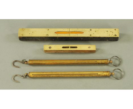 Two vintage silver scales and two brass mounted spirit levels, longest 30 cm.