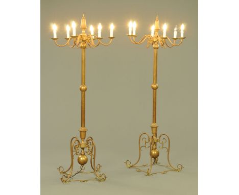A pair of French brass six branch freestanding lights, early 20th century, the finial with suspension loop above a single kno