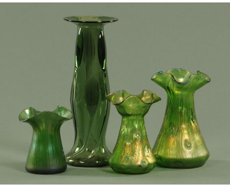 Four green glass Art Nouveau vases, attributed to Powell, each with ground pontil.  Tallest 30 cm, smallest 13 cm.  CONDITION