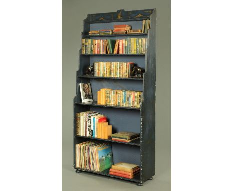 A tall blue lacquered waterfall open bookcase, the top with gilt chinoiserie decoration of a kneeling figure looking skyward 