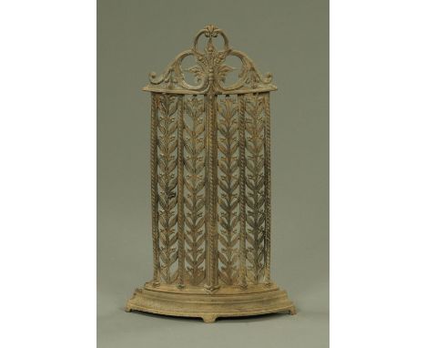 A Victorian cast iron corner stick stand, with copper drip tray.  Height 75 cm, width at base 44 cm. 