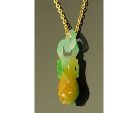 A Chinese jade pendant, vase form, suspended on a gold plated chain.  Pendant height 42 mm. CONDITION REPORT: The pendant app