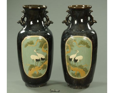 A large pair of decorative Chinese vases, 20th century, with relief moulded mirror image panels of two Manchurian cranes stan