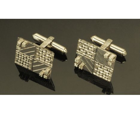 A pair of Chinese cufflinks, with character marks.