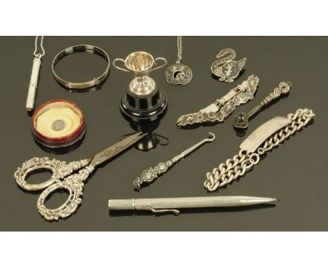 The Bijouterie Cabinet - A small collection of silver and white metal items, to include a mini-magnifier, miniature trophy, s