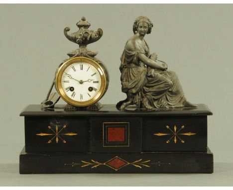 A Victorian black slate and spelter mantle clock, circa 1880, the clock with eight day movement chiming on a bell, with urn f