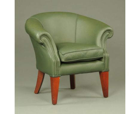 An Art Deco inspired green leather tub chair, late 20th century, supported upon square tapering front legs, width 86 cm, heig