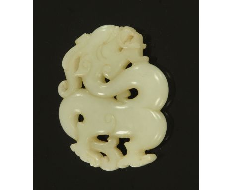 A Chinese jade dragon pendant, early 20th century, carved both sides, the stone a uniform colour throughout, 5.2 cm high (see