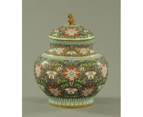 A Chinese champleve enamel vase and cover, early 20th century, the cover with Shi Shi knop and decorated throughout with lotu