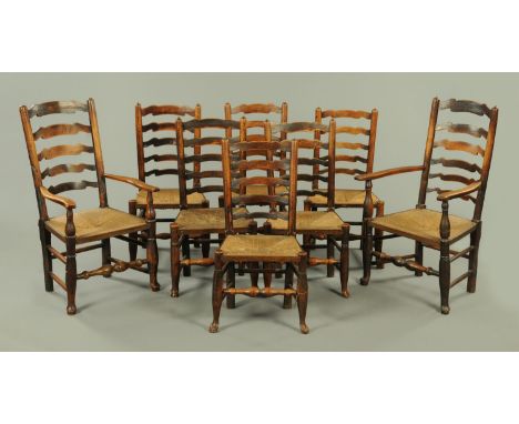 A matched set of eight early 19th century country elm ladder back dining chairs (6+2), of typical form with rush seats and tu
