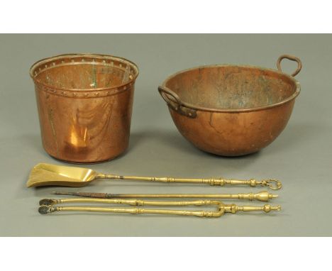 A matched set of 19th century brass fire tools, a copper two handled dished bowl and a copper planter.