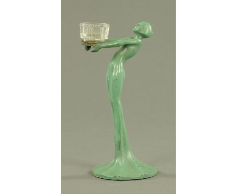 An Art Deco cast metal figure of a female, early 20th century, the tall slender body leaning back with her arms outstretched 