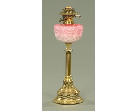 A Victorian polished brass oil lamp, with moulded pink opalescent glass reservoir, 53 cm. CONDITION REPORT: A quarter of the 