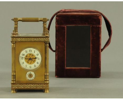 A French brass timepiece carriage clock alarm, late 19th/early 20th century, the dials with Roman numerals and with fluted co