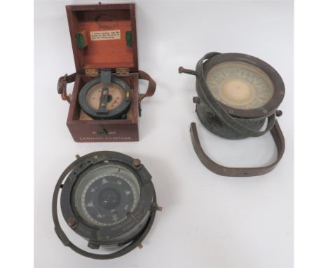 Three Various Large Compassesconsisting medium landing compass Ref 6B/0.34.  Grey painted finish.  The top with lift up sight