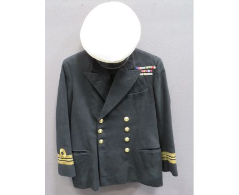 Post 1953 Royal Navy Lieutenant-Commander's Uniformconsisting black melton, double breasted, open collar tunic.  Left breast 