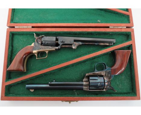 Two Modern Miniature Colt Revolversconsisting Colt Navy revolver.  3 1/2 inch, blued, octagonal barrel. Lower loading rod.  E