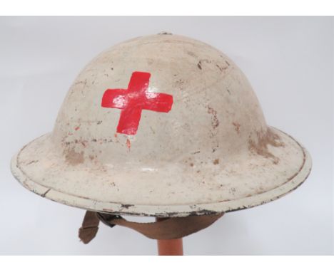 WW2 Red Cross British Steel Helmetwhite, overpainted outer shell.  The front with painted red cross.  Green inner painted she