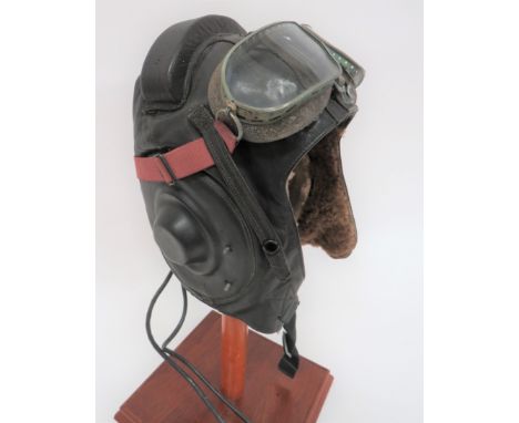 Post War Russian Air Crew Helmet and Gogglesbrown leather, multi panel helmet.  Padded section across the crown.  Rubber earp