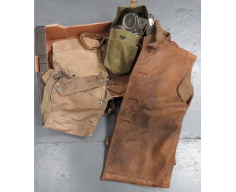 WW2 Leather Jerkin and Gas Mask consisting brown leather jerkin, secured to the front by four composite buttons. &nbsp;Intern