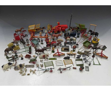 A collection of Britains and other painted cast lead farm models, comprising tractors, animals, farm workers and farm accesso