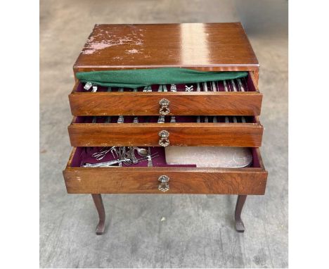 A canteen of cutlery on legs, three drawers containing cutlery by Oneida Silversmiths and others (1)