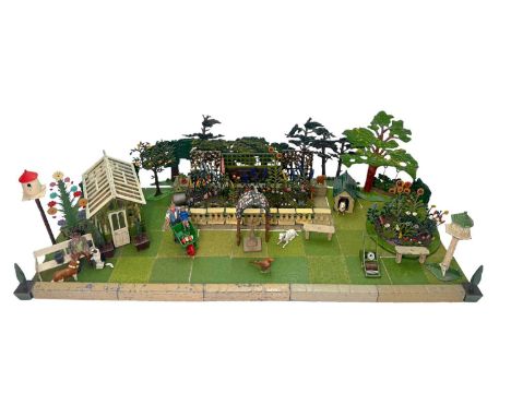 An extensive collection of Britains Miniature Garden painted lead items, c.1935, to include a boxed 'Span Roof Green House' N