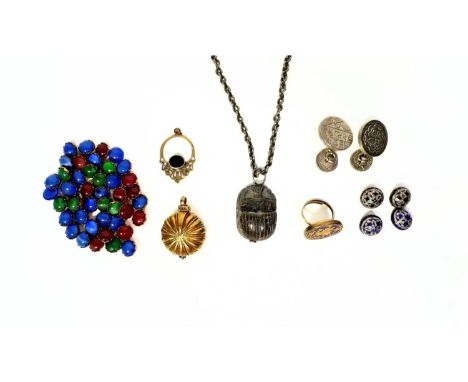 A Thewa plaque on ring mount, yellow metal on cobalt blue glass, silver gilt Indian pomander, stone scarab on white metal cha