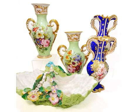 Two Coalport or Rockingham type twin handles vases, blue ground with gilding, each vase with floral panels and romantic scene