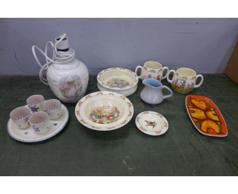 Royal Doulton Bunnykins china, a Poole dish, egg cup set and a jug and a Beatrix Potter jug 
