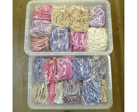 A collection of 470 three string fashion pearl necklaces 