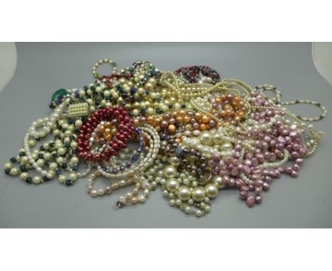 A collection of pearl jewellery including silver clasps 