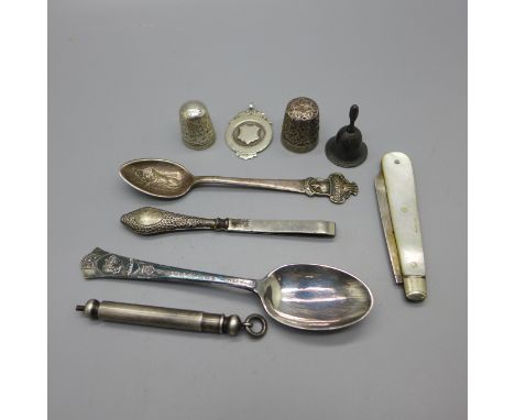A Sampson Mordan propelling pencil, two thimbles, a Rolex spoon, a silver and mother of pearl fruit knife, a silver fob, etc.