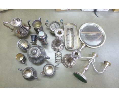 A box of silver plated items, including toast rack, candlesticks, mugs and tea service**PLEASE NOTE THIS LOT IS NOT ELIGIBLE 