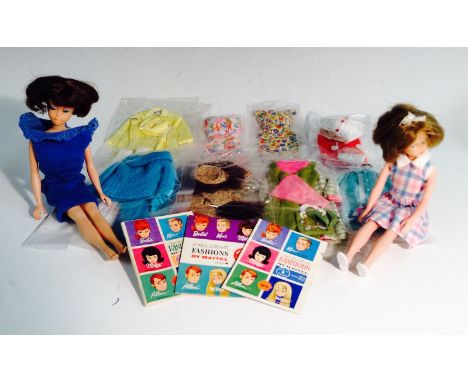 Barbie - a Mattel 1960s Barbie, several fashion outfits, miniature accessory booklets, novelty wig outfit in blister pack; a 