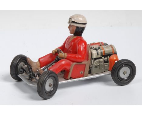 A Schuco 1055 tinplate clockwork go-cart, the driver with red overalls, lithographed engine detail, steerable front rubber ty