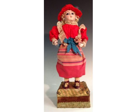 A 19th century Bru Jne French clock work musical automaton socket head doll, bisque head. fixed blue eyes, ear studs, blond c