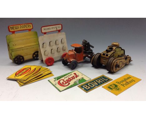 A Jo Hill Co/Tootsie Toys - Mack anti-aircraft gun;  a tin plate clock work tank;  two news paper stands;  Gold Flake;   Bp; 