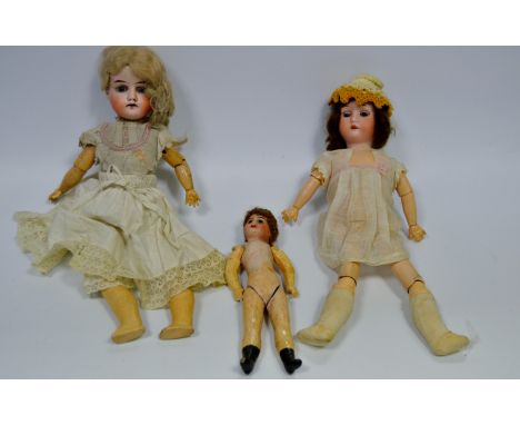 A William Goebel doll, with sleeping blue eyes, open mouth and four teeth, jointed wooden body, 36cm high, marked G.W, 1203/0
